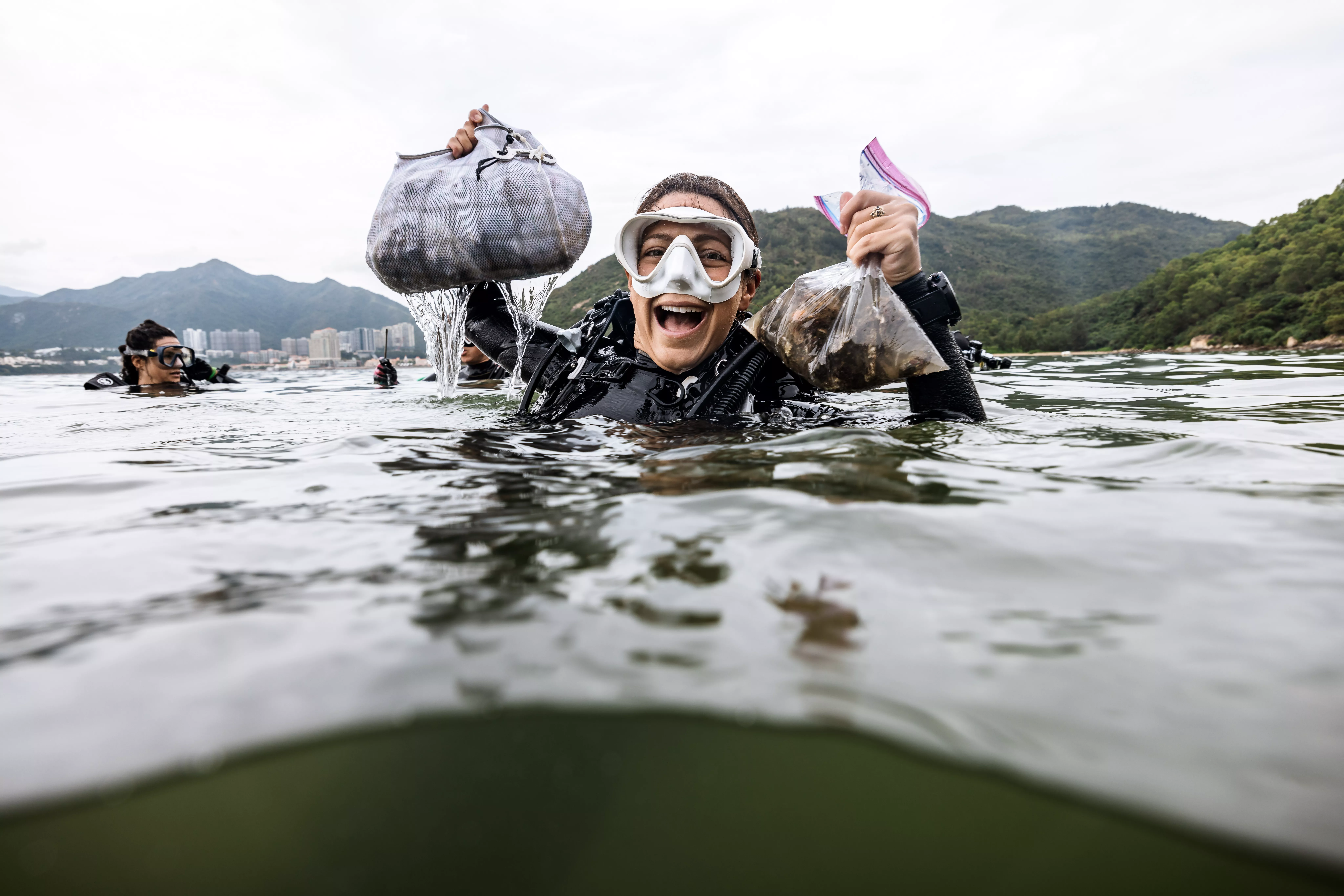 Andi Cross celebrating ocean cleanup - conservation in action