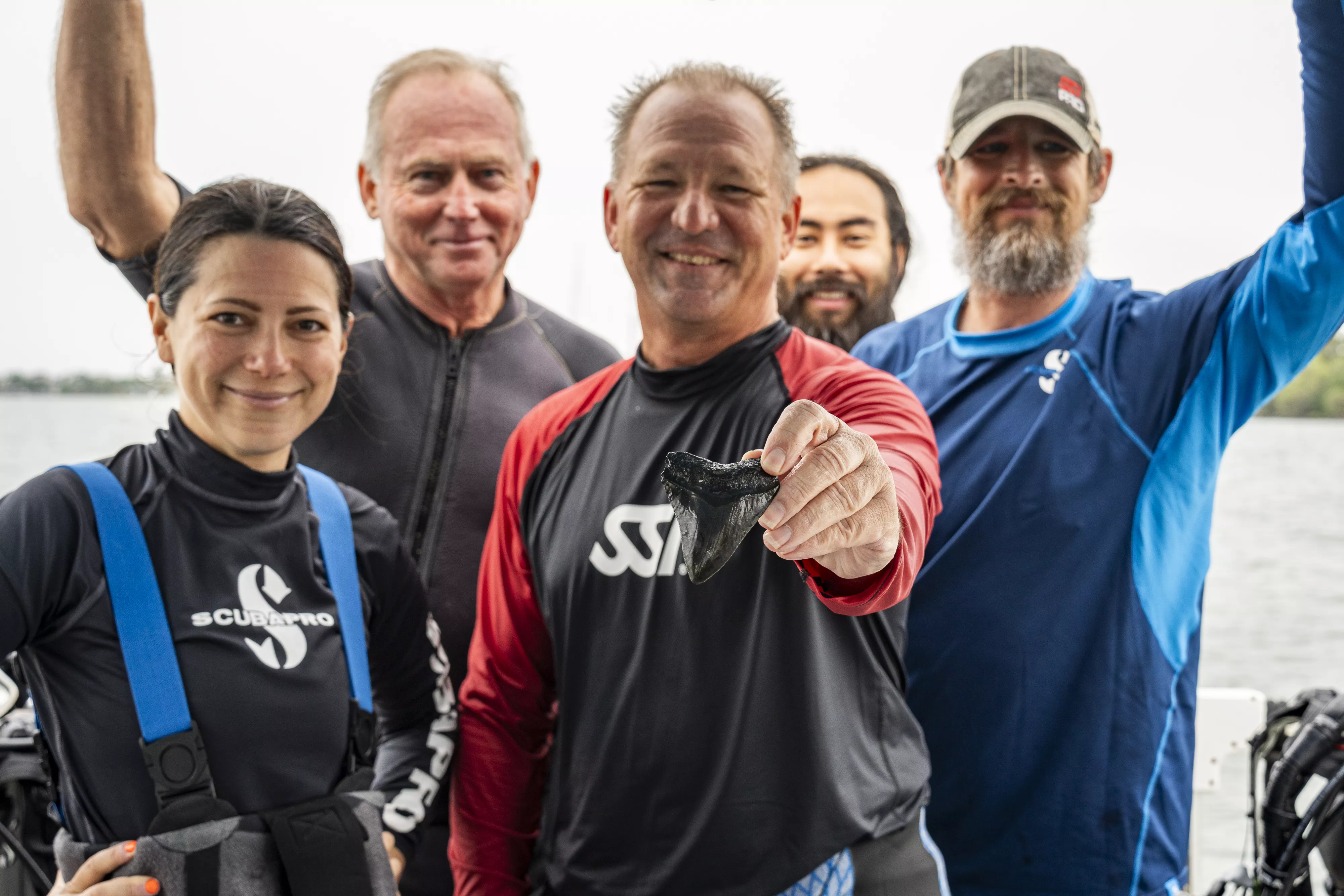 Dive team discovering megalodon tooth - expedition moment in South Carolina waters